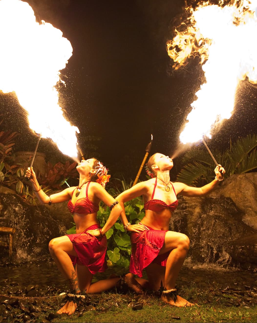 Soul Fire Productions performers blowing twin fire plumes during a live show