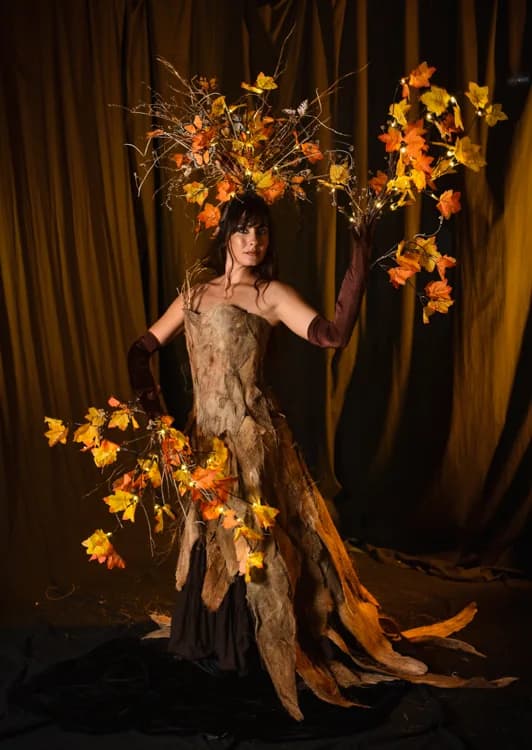 Tree goddess character in an autumn-toned costume